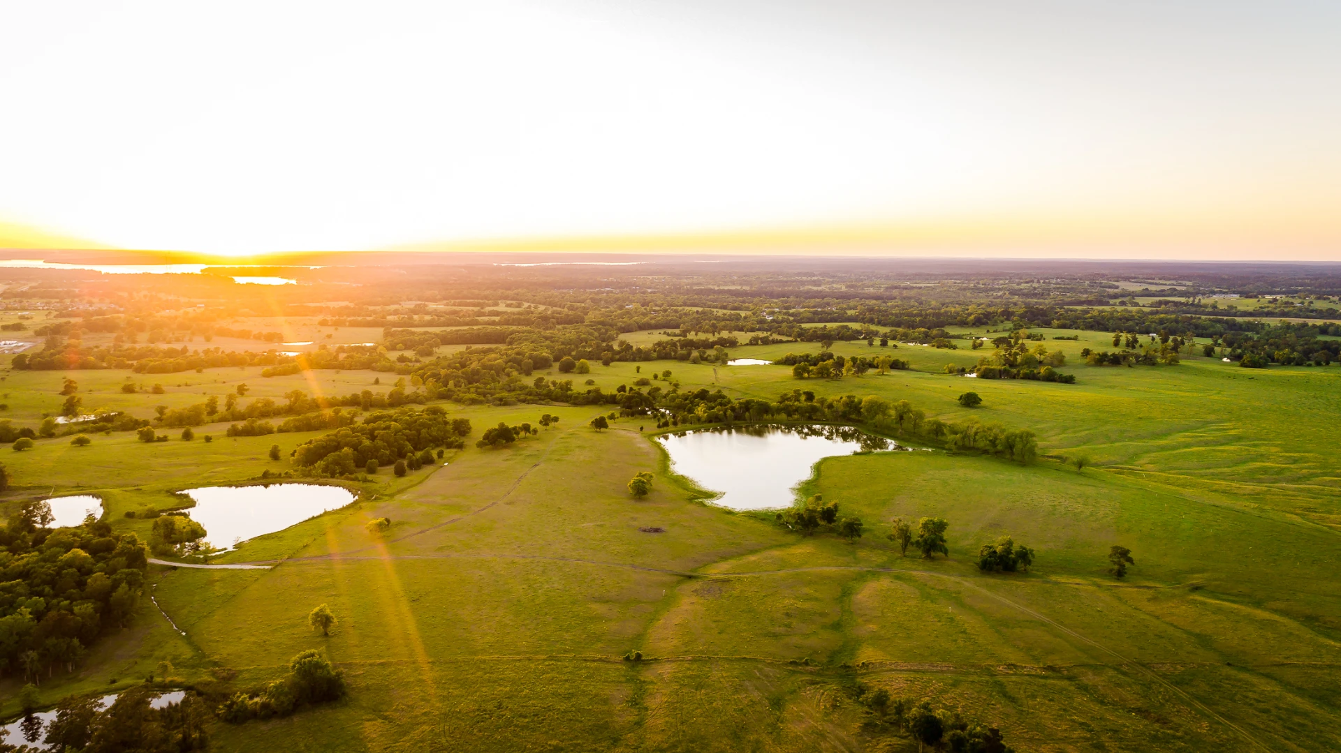 an overview shot of land during sunset