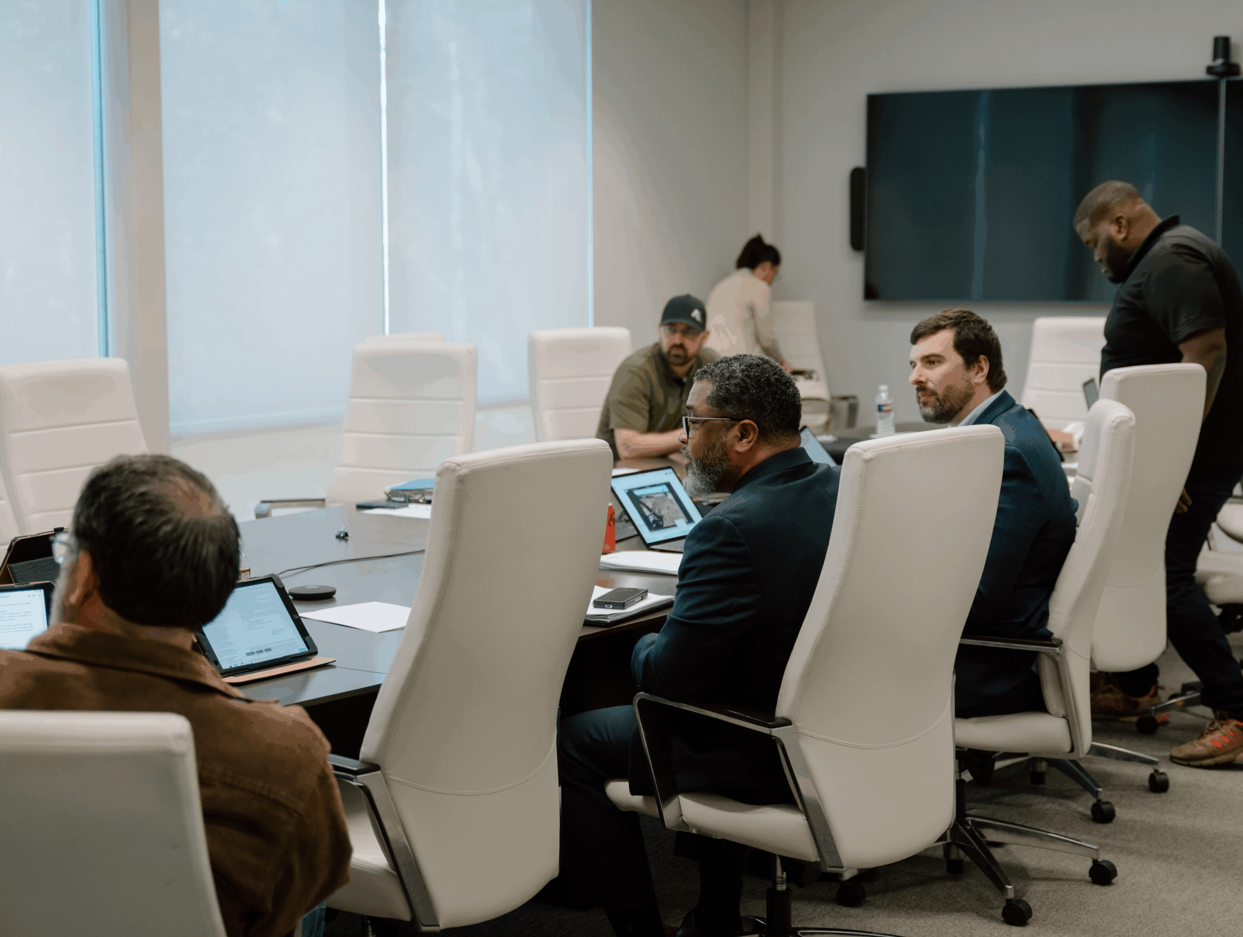 muller law group team members meeting in the conference room