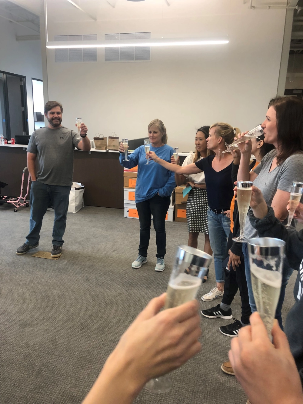 MLG employees cheering to moving day