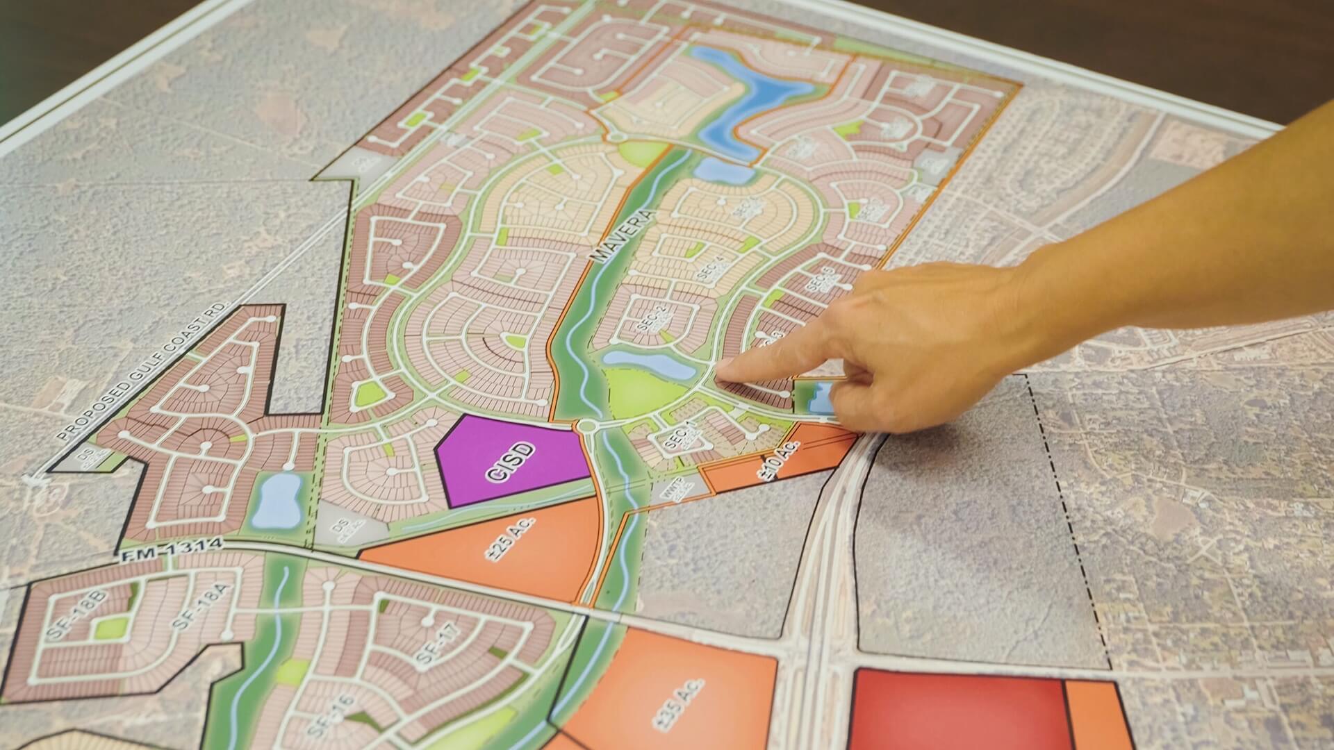 person pointing at a map